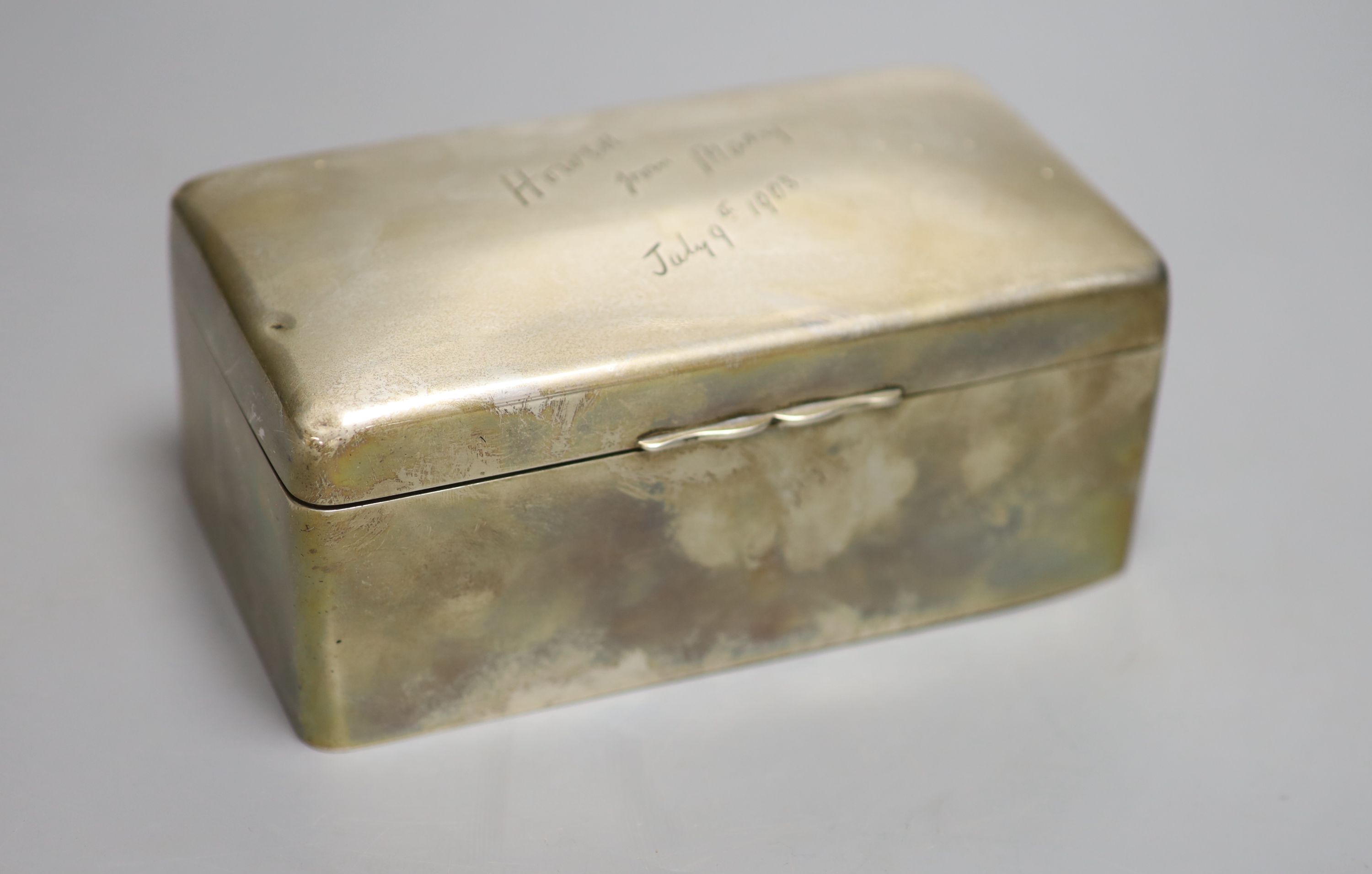 An Edwardian silver rectangular cigarette box, with engraved inscription, A&J Zimmerman, Birmingham, 1902, 17.3cm & 3 spoons.